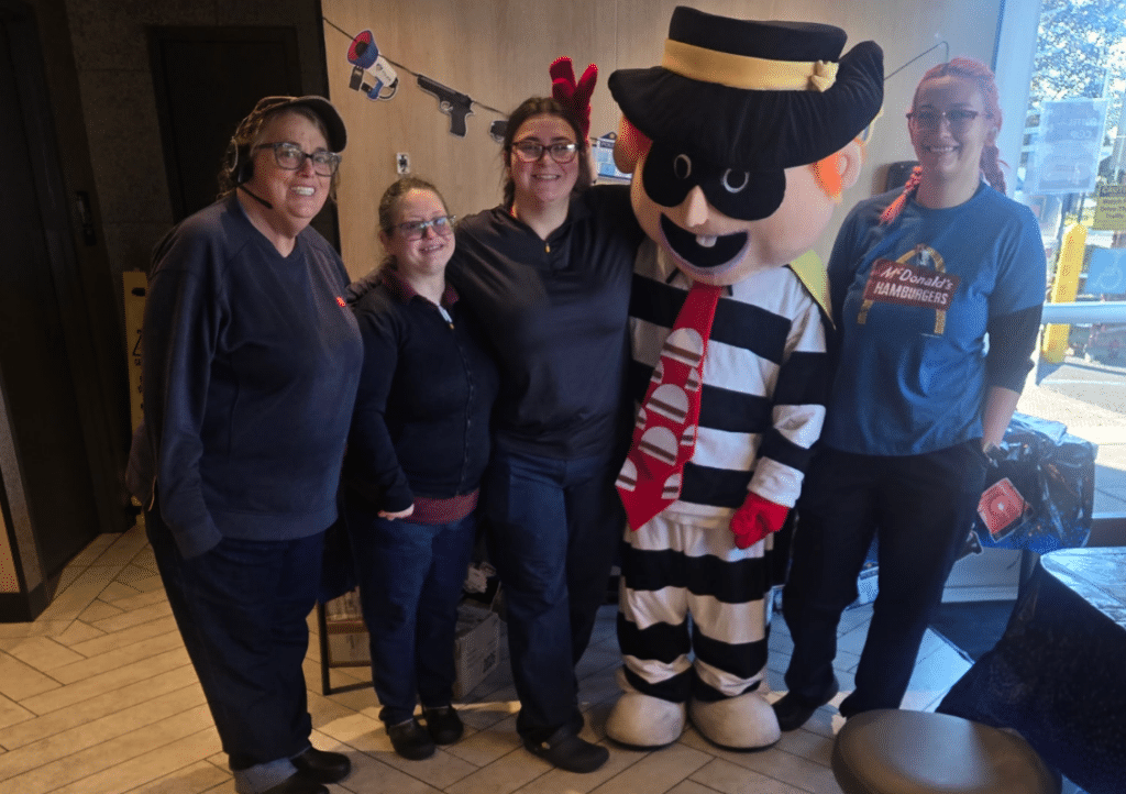McDonald's team members posing with Hamburglar